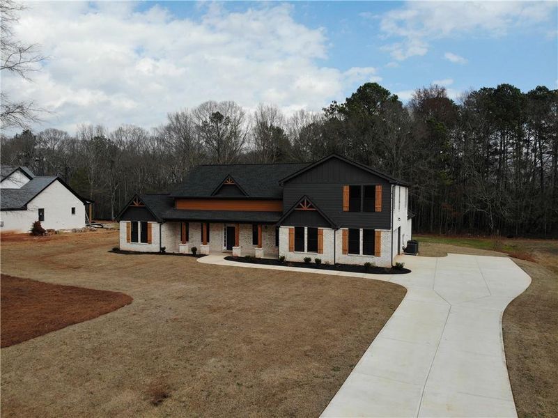Front exterior of a new home in , Covington, GA, highlighting curb appeal (Image 27).