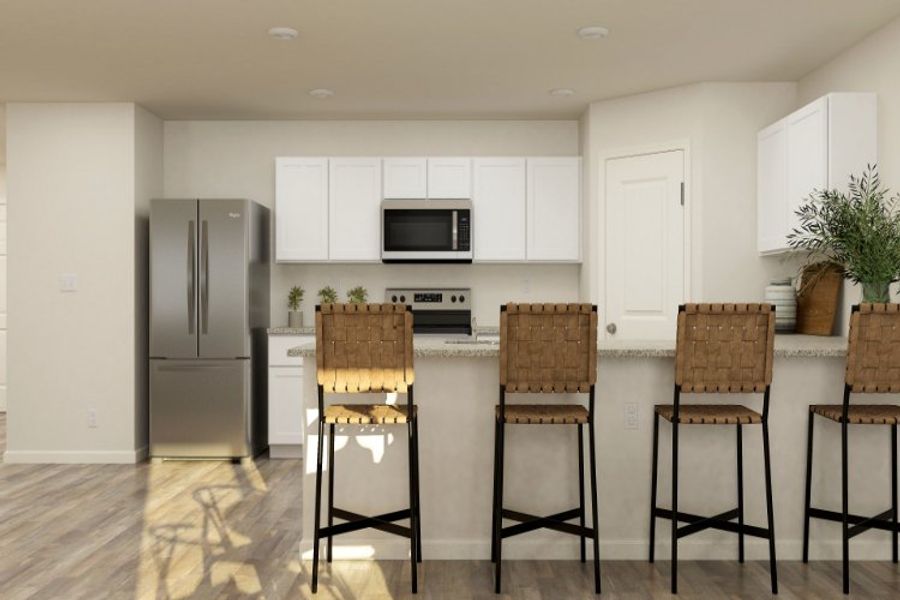 A kitchen with white cabinets.