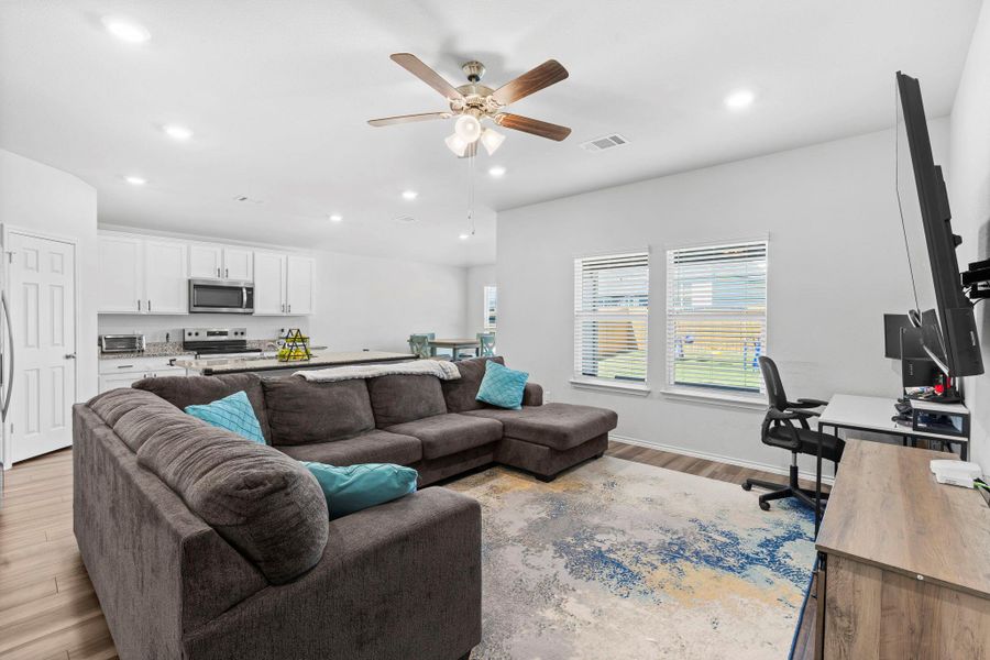 An open-concept living space integrates a well-appointed kitchen and comfortable lounge area. An open-concept living space integrates a well-appointed kitchen and comfortable lounge area.