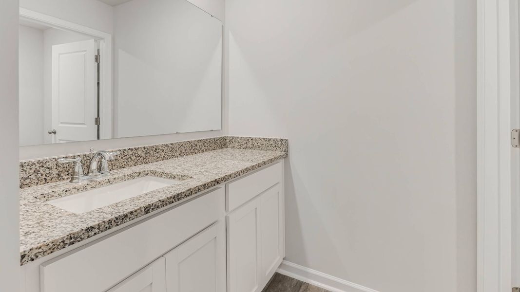 Representative furnished interior of a home built from the HAYDEN by D.R. Horton in Saltgrass Landing, Winnabow (Image 11).