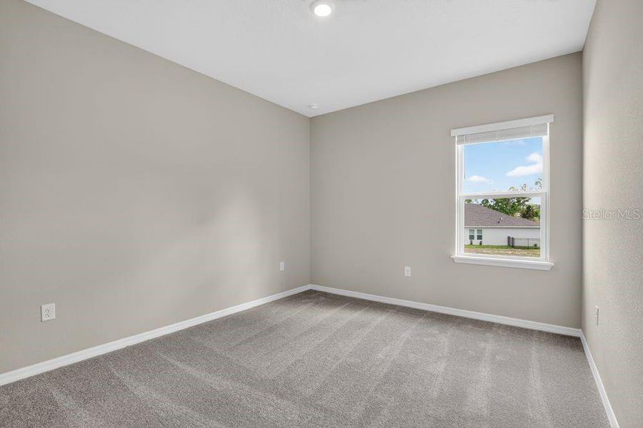 Spacious, unfurnished interior of a new home in Ardisia Park, New Smyrna Beach (Image 35).
