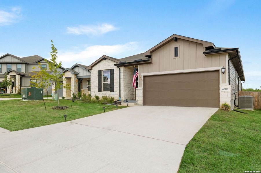 Front exterior of a new home in Remington Ranch, San Antonio, TX, highlighting curb appeal (Image 1). Front exterior of a new home in Remington Ranch, San Antonio, TX, highlighting curb appeal (Image 1).