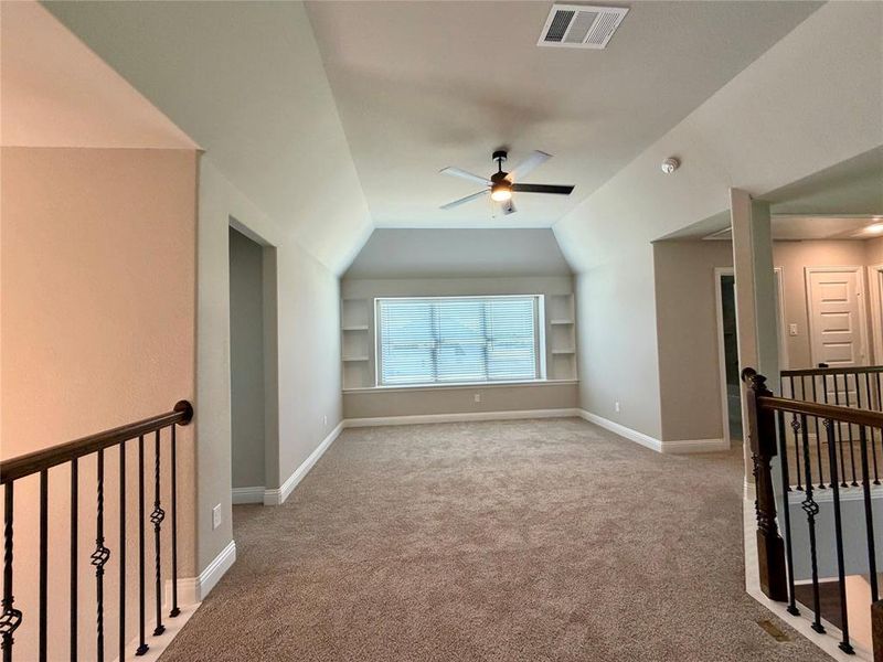 Large open gameroom as you come up the stairs