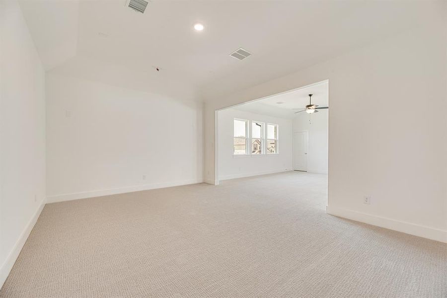 Spare room with light colored carpet and recessed lighting Spare room with light colored carpet and recessed lighting
