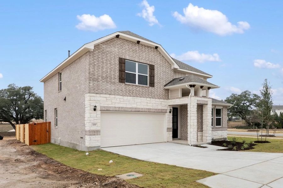Front exterior of a new home in Berry Creek Highlands, Georgetown, TX, highlighting curb appeal (Image 27).