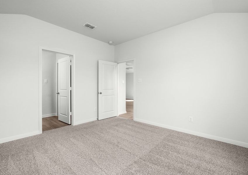 The master suite has a large bedroom, an ensuite bathroom and a walk-in closet.