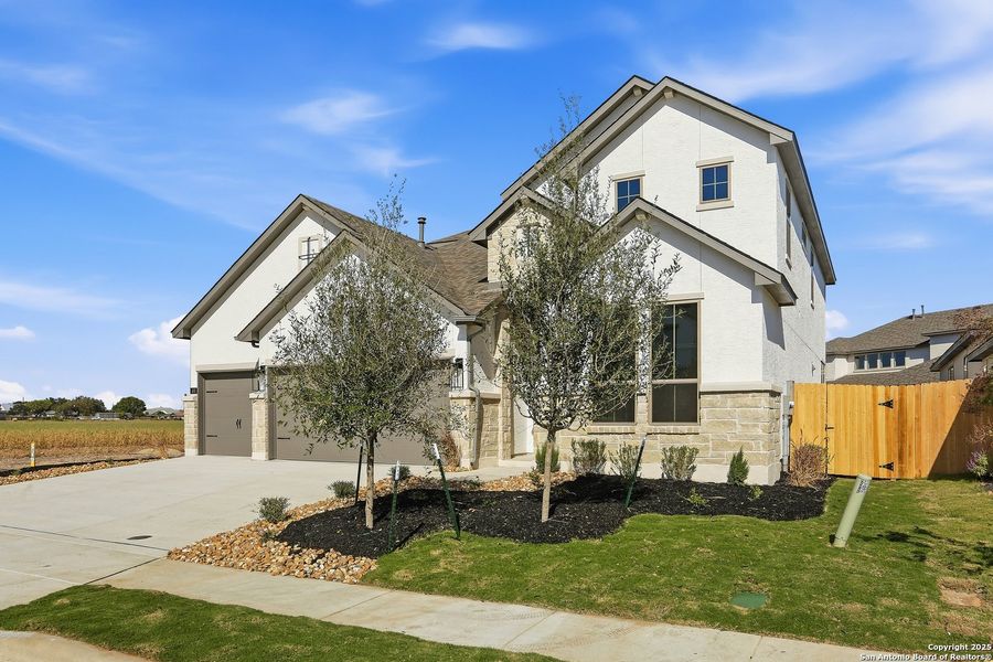 Front exterior of a new home in Legacy at Lake Dunlap, New Braunfels, TX, highlighting curb appeal (Image 2). Front exterior of a new home in Legacy at Lake Dunlap, New Braunfels, TX, highlighting curb appeal (Image 2).