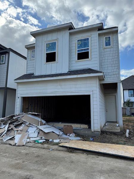 Three-story home with 3 bedrooms, 3.5 baths, and 2 car garage.