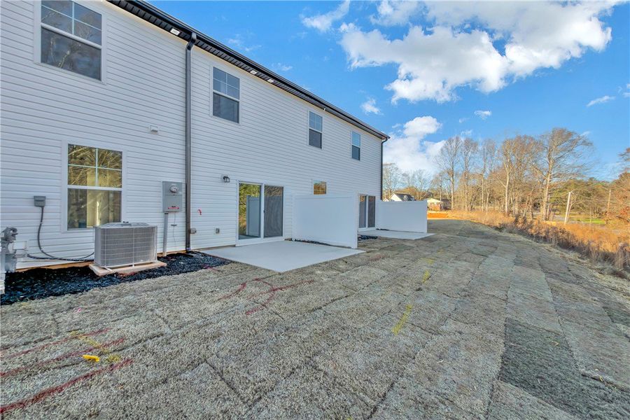 Exterior details and patio area of a home in Meece Townhomes, Easley (Image 4).