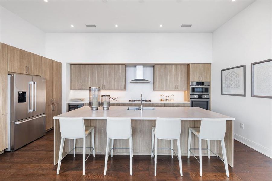 Easily prep and entertain from the kitchen that overlooks the living room and dining room.  Kitchen is complete with full oven, microwave with steam oven capability, and Bosch dishwasher.