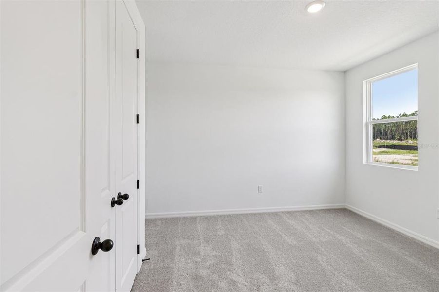 Spacious, unfurnished interior of a new home in Ardisia Park, New Smyrna Beach (Image 15).