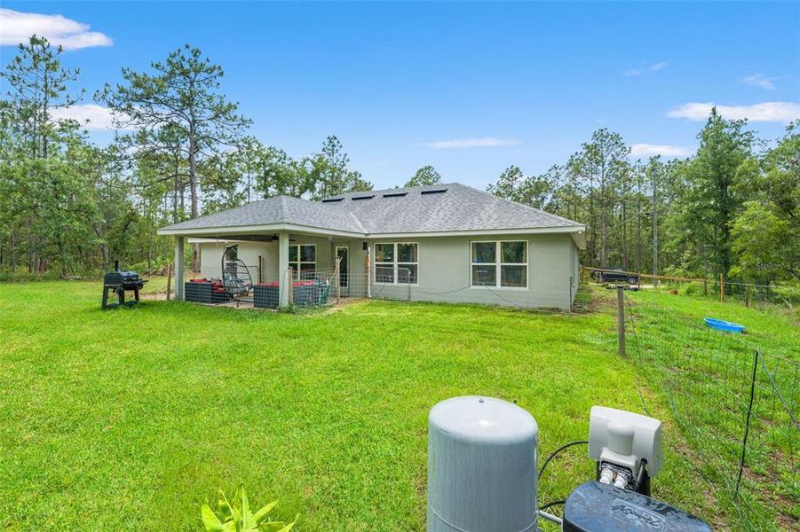 Exterior details and patio area of a home in Royal Highlands, Brooksville (Image 25).