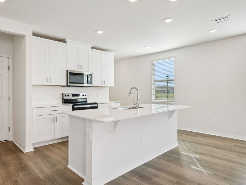 Furnished interior view inside a new home in The Meadow at Crossprairie Townes, St. Cloud (Image 4).