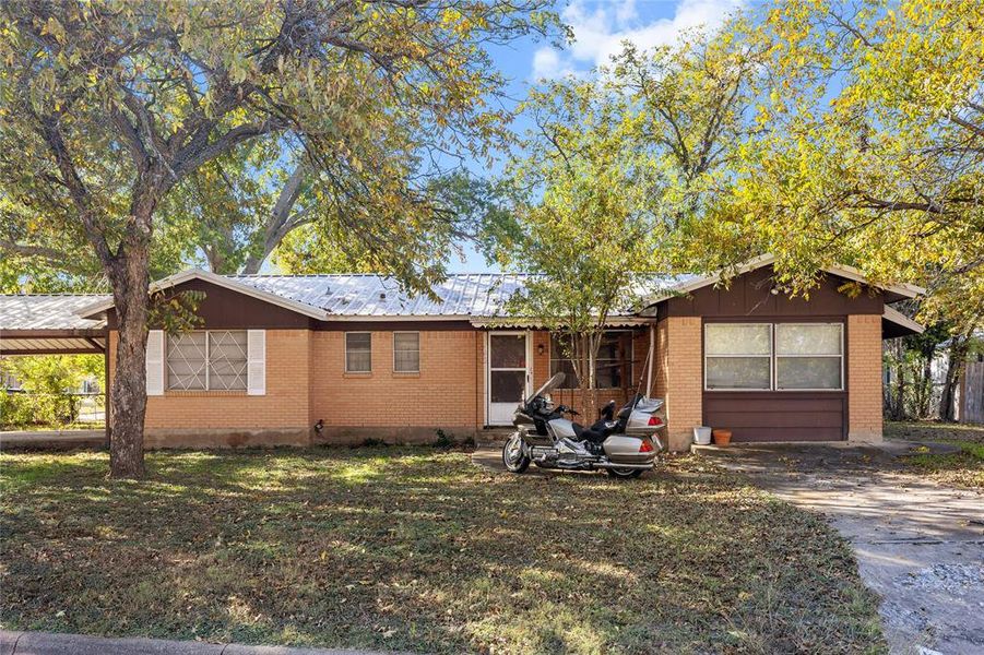 Front exterior of a new home in , Brownwood, TX, highlighting curb appeal (Image 1).