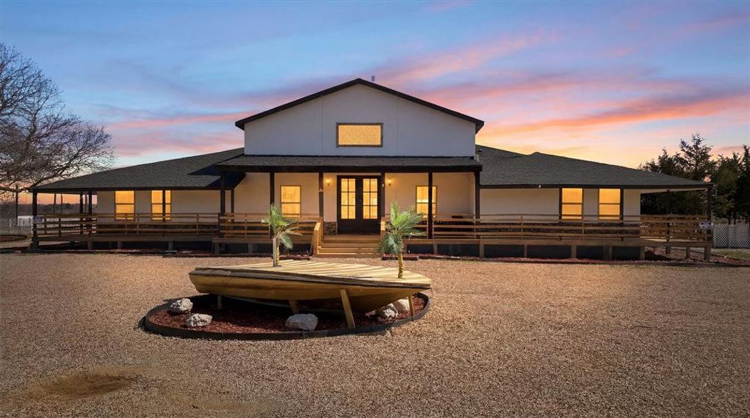 Front of building at dusk.