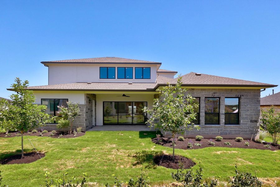 Front exterior of a new home in Rough Hollow - Las Brisas, Austin, TX, highlighting curb appeal (Image 1). Front exterior of a new home in Rough Hollow - Las Brisas, Austin, TX, highlighting curb appeal (Image 1).