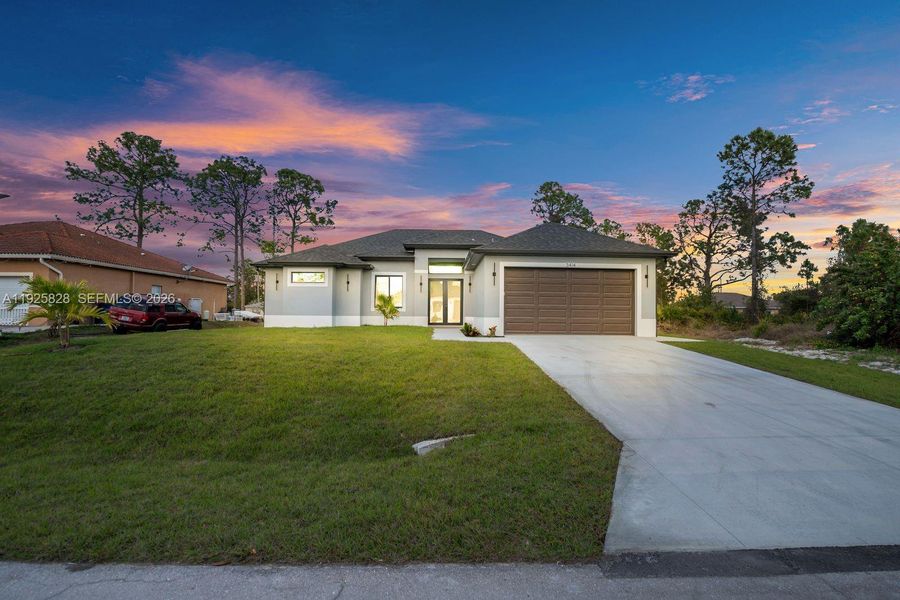 Front exterior of a new home in , Lehigh Acres, FL, highlighting curb appeal (Image 2). Front exterior of a new home in , Lehigh Acres, FL, highlighting curb appeal (Image 2).