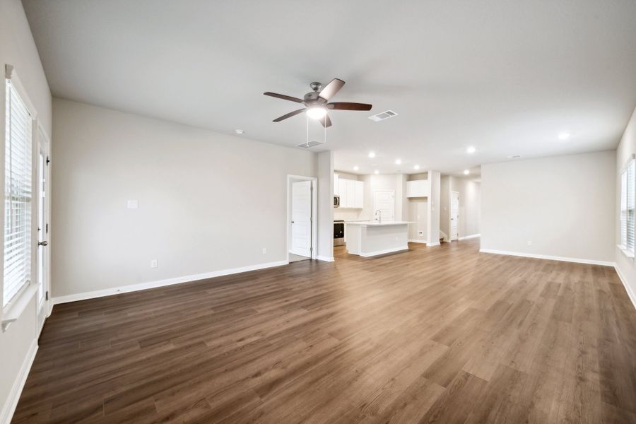 Living room and dining room in the Reynolds floorplan at a Meritage Homes community.