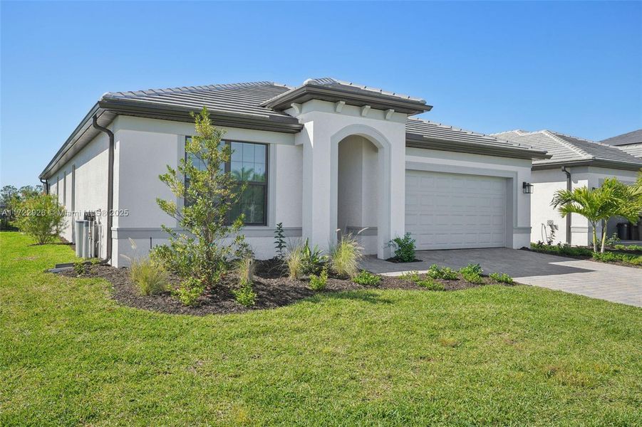 Front exterior of a new home in , Fort Myers, FL, highlighting curb appeal (Image 2). Front exterior of a new home in , Fort Myers, FL, highlighting curb appeal (Image 2).