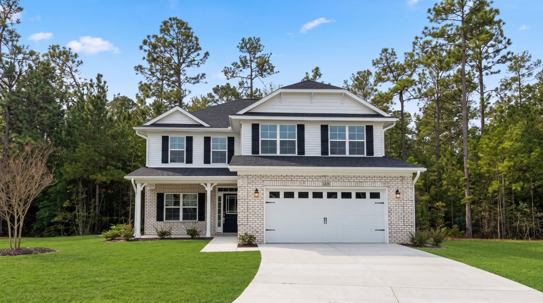 Front exterior of a new home in Palmetto Creek, Bolivia, NC, highlighting curb appeal (Image 2). Front exterior of a new home in Palmetto Creek, Bolivia, NC, highlighting curb appeal (Image 2).