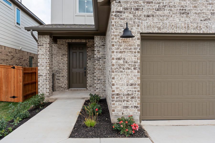 Exterior details and patio area of a home in Lariat, Liberty Hill (Image 4).