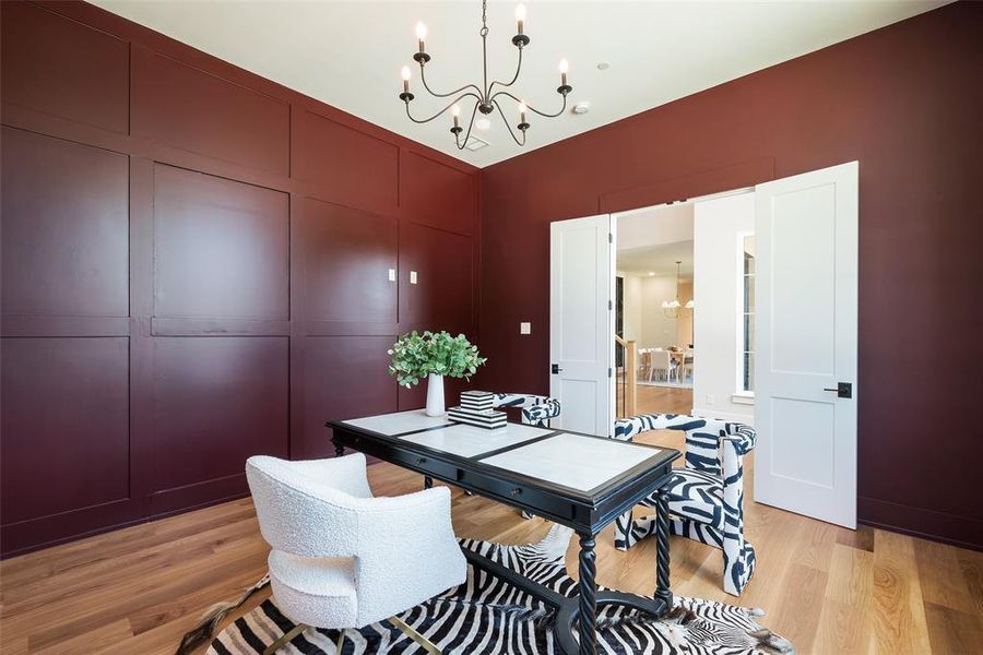 Dining area with an inviting chandelier and light wood-type flooring