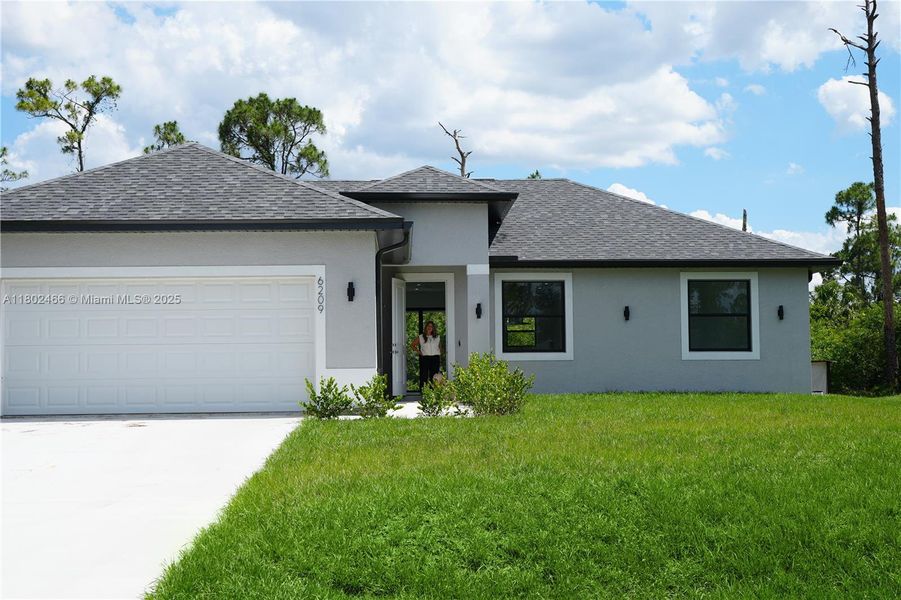 Front exterior of a new home in , Labelle, FL, highlighting curb appeal (Image 1).