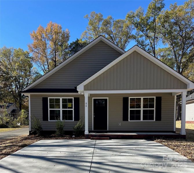 Front exterior of a new home in , Concord, NC, highlighting curb appeal (Image 1).