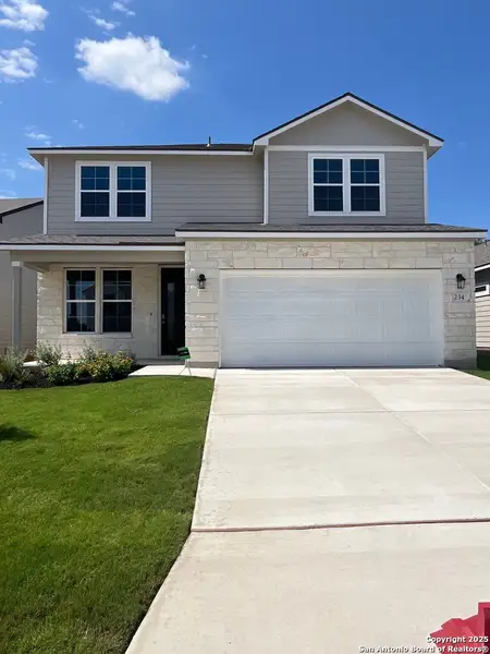 Front exterior of a new home in The Meadows at Hunters Ranch, San Antonio, TX, highlighting curb appeal (Image 1).