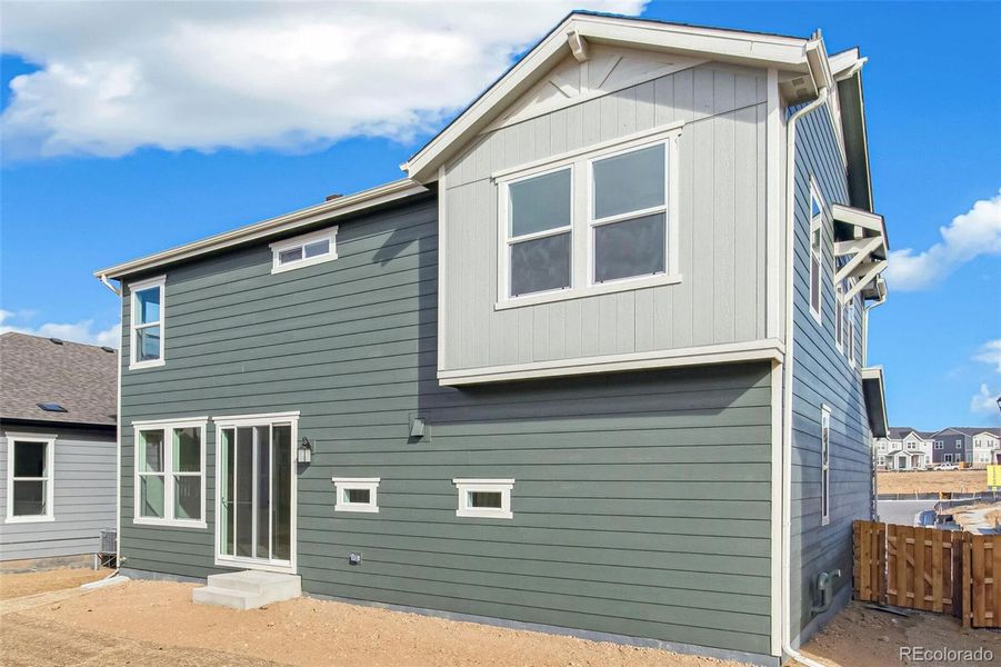 Front exterior of a new home in Turnberry, Commerce City, CO, highlighting curb appeal (Image 21).