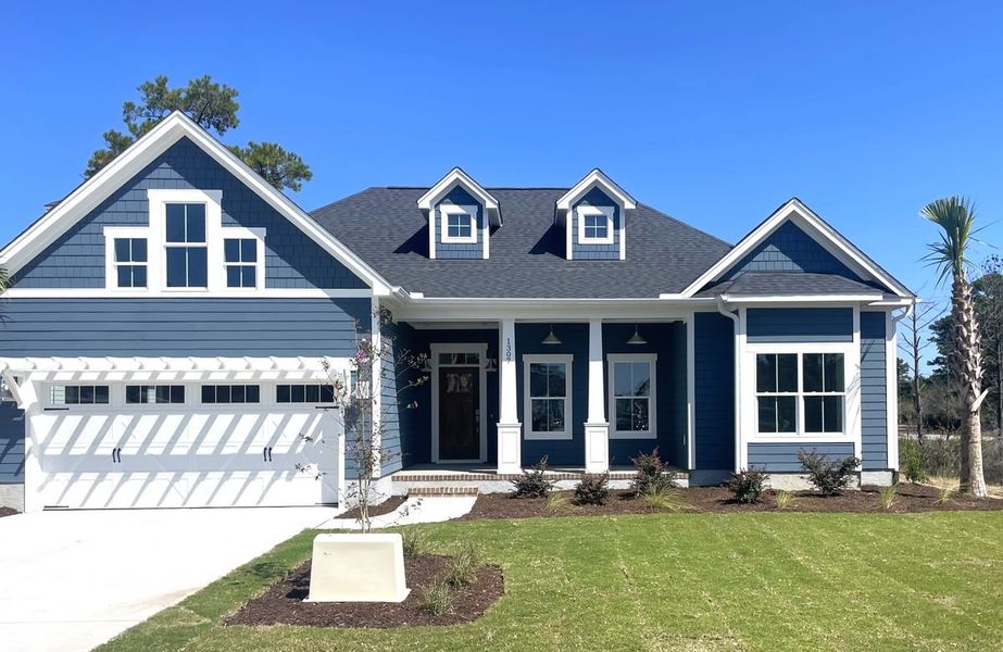 Representative exterior photo of a completed home built from the Claremont by Bill Clark Homes in The Sanctuary at Sunset Beach, Sunset Beach, NC (Image 28). Representative exterior photo of a completed home built from the Claremont by Bill Clark Homes in The Sanctuary at Sunset Beach, Sunset Beach, NC (Image 28).