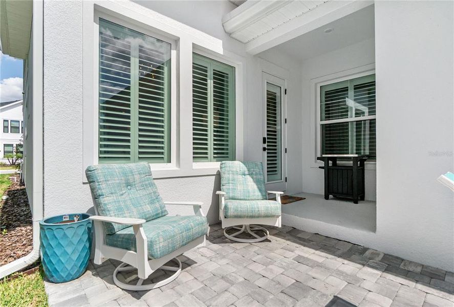Exterior details and patio area of a home in Emerald Landing at Waterside at Lakewood Ranch – Cottage Series, Sarasota (Image 4). Exterior details and patio area of a home in Emerald Landing at Waterside at Lakewood Ranch – Cottage Series, Sarasota (Image 4).