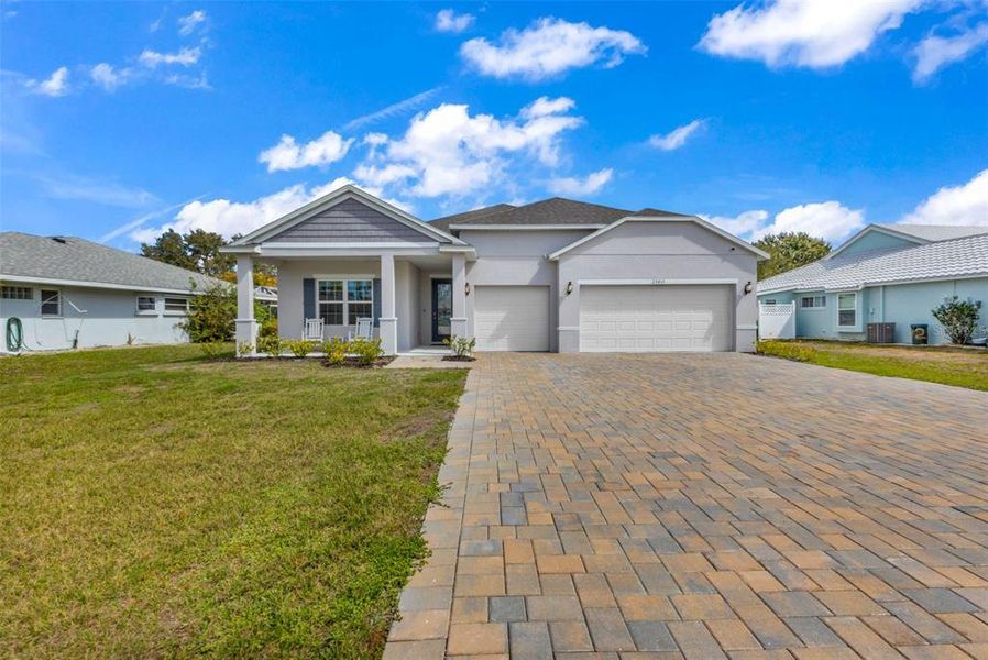 Front exterior of a new home in , Punta Gorda, FL, highlighting curb appeal (Image 24).