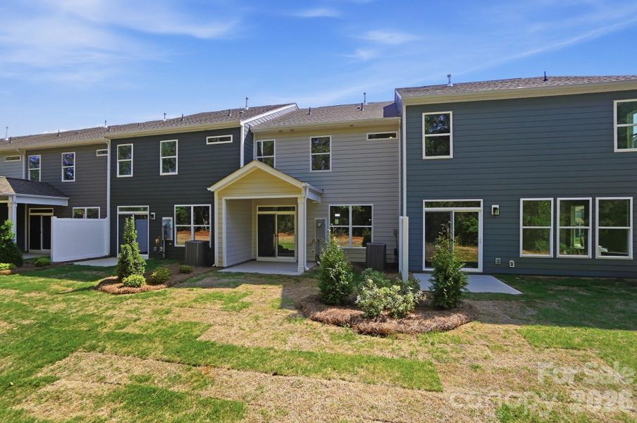 Exterior details and patio area of a home in Blythe Mill Townhomes, Waxhaw (Image 24).