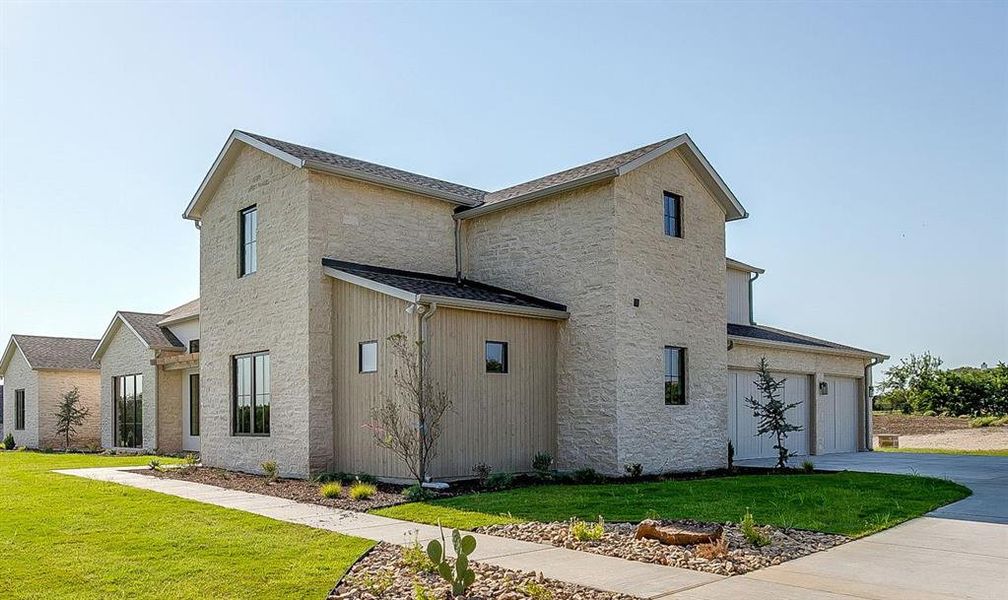 Front exterior of a new home in , Aledo, TX, highlighting curb appeal (Image 23). Front exterior of a new home in , Aledo, TX, highlighting curb appeal (Image 23).