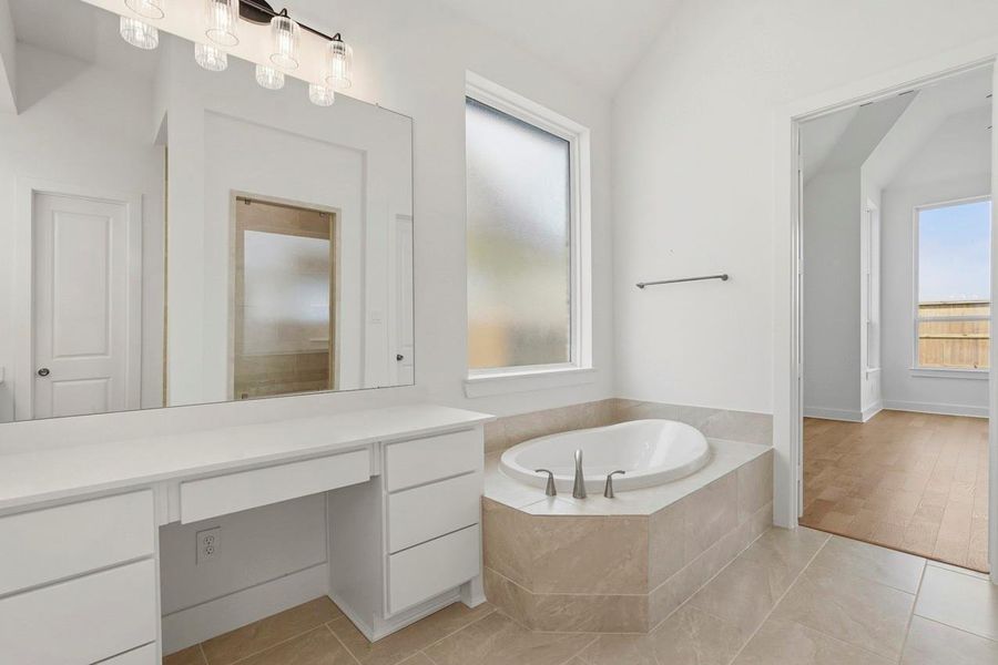 Primary Bathroom has a large soaking tub- perfect to unwind at the end of the day.