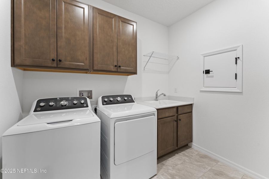 Furnished interior view inside a new home in Summer Bay at Grand Oaks, St. Augustine (Image 13).