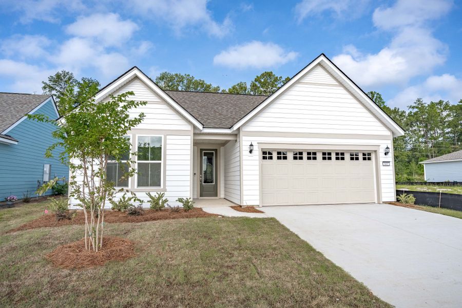 Front exterior of a new home in Del Webb Charleston at Nexton, Summerville, SC, highlighting curb appeal (Image 21). Front exterior of a new home in Del Webb Charleston at Nexton, Summerville, SC, highlighting curb appeal (Image 21).