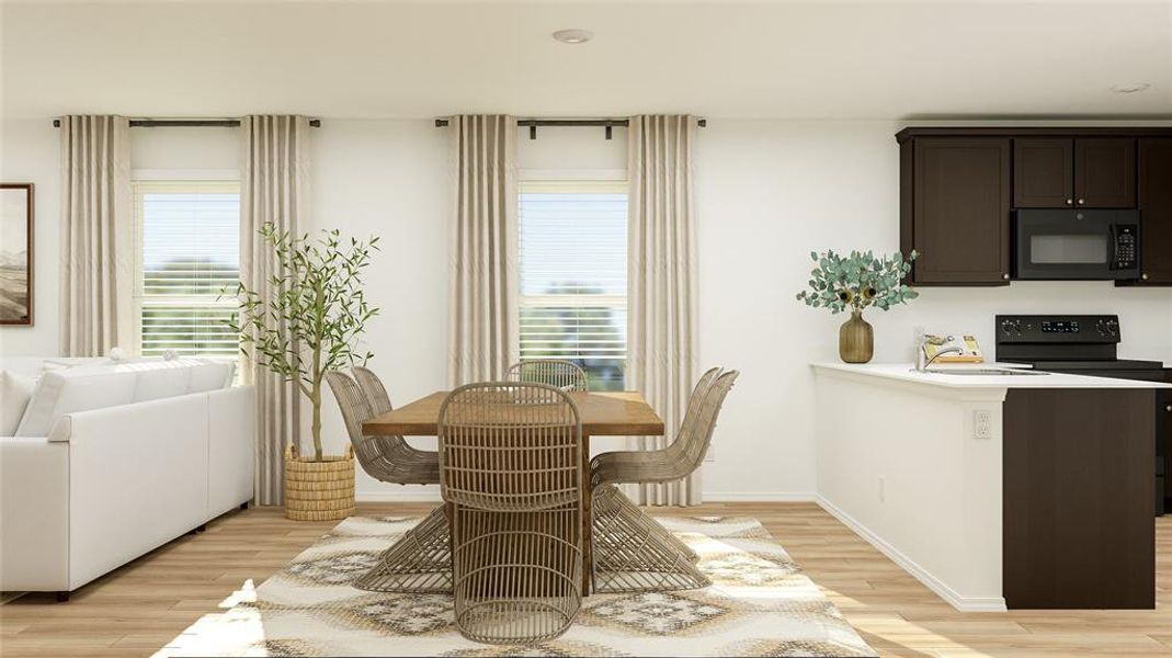 Dining space featuring light hardwood / wood-style floors and a wealth of natural light