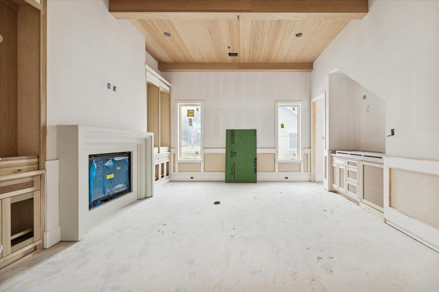 Stunning modern study or home office featuring high ceilings, clean lines, and a sleek contemporary fireplace. This bright workspace is filled with natural light from large windows and offers an open-concept feel with premium finishes. Perfect for a quiet professional environment, this versatile room combines luxury design with functional workspace. Stunning modern study or home office featuring high ceilings, clean lines, and a sleek contemporary fireplace. This bright workspace is filled with natural light from large windows and offers an open-concept feel with premium finishes. Perfect for a quiet professional environment, this versatile room combines luxury design with functional workspace.