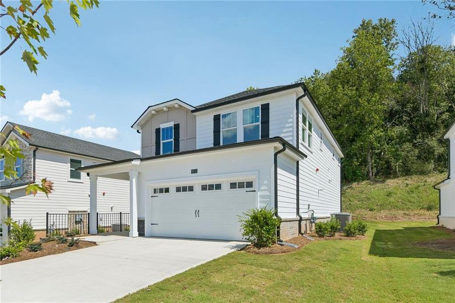 Front exterior of a new home in , Cumming, GA, highlighting curb appeal (Image 2). Front exterior of a new home in , Cumming, GA, highlighting curb appeal (Image 2).