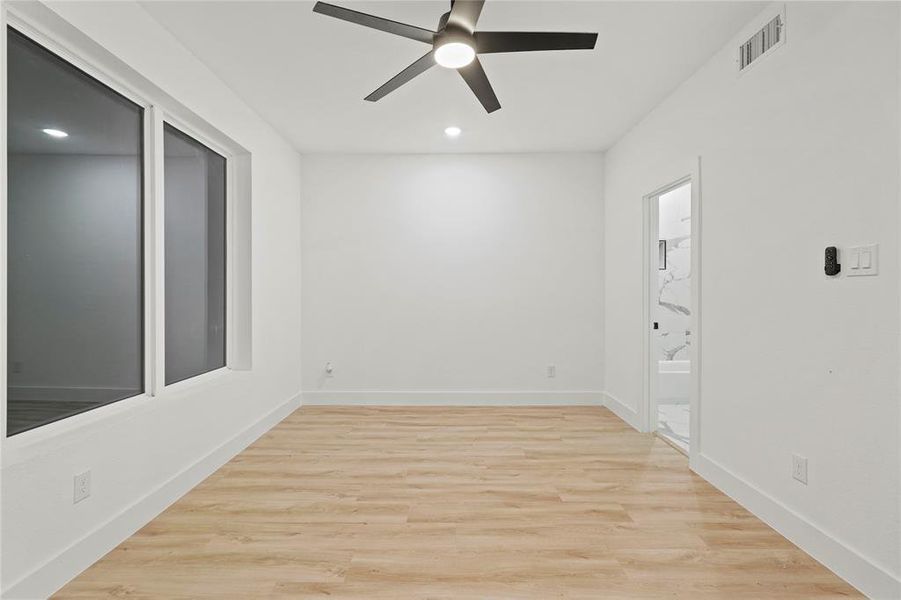 Spare room with light wood-style flooring, a ceiling fan, and recessed lighting Spare room with light wood-style flooring, a ceiling fan, and recessed lighting