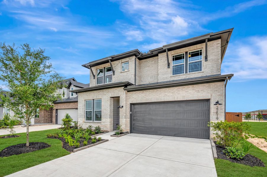 Front exterior of a new home in Elyson - Reserve Collection, Katy, TX, highlighting curb appeal (Image 23).