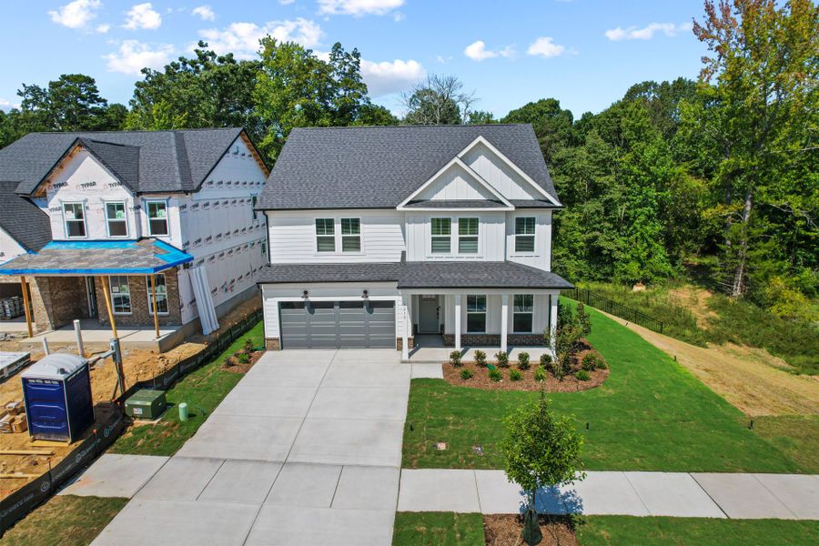 Front exterior of a new home in Elmbrook, Indian Trail, NC, highlighting curb appeal (Image 34). Front exterior of a new home in Elmbrook, Indian Trail, NC, highlighting curb appeal (Image 34).