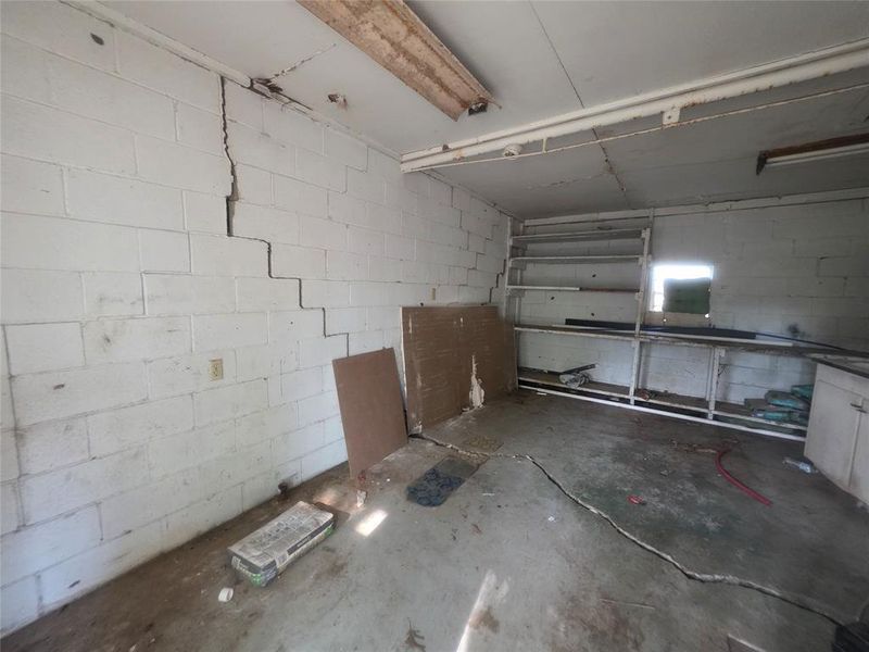 Storage room behind carport.