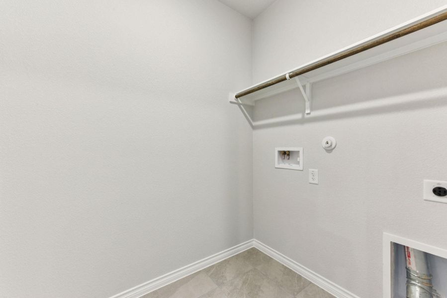 Laundry room with hookup for a gas dryer, hookup for an electric dryer, and hookup for a washing machine