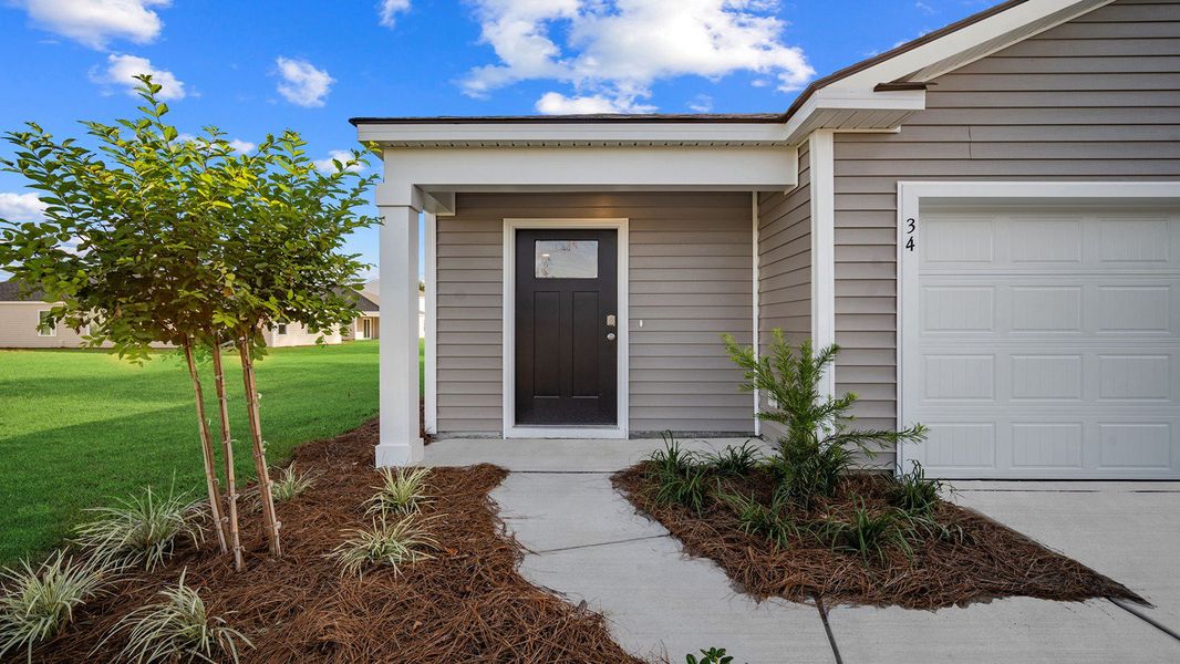 Exterior details and patio area of a home in The Groves at Bees Creek, Ridgeland (Image 2).