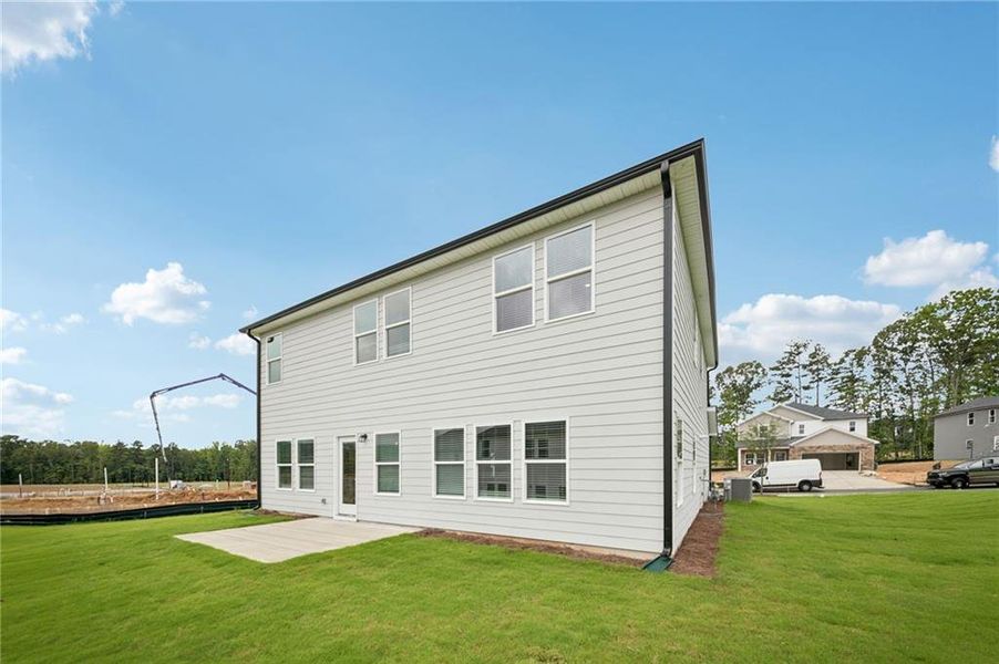 Exterior details and patio area of a home in Northwoods at Mirror Lake, Villa Rica (Image 28).