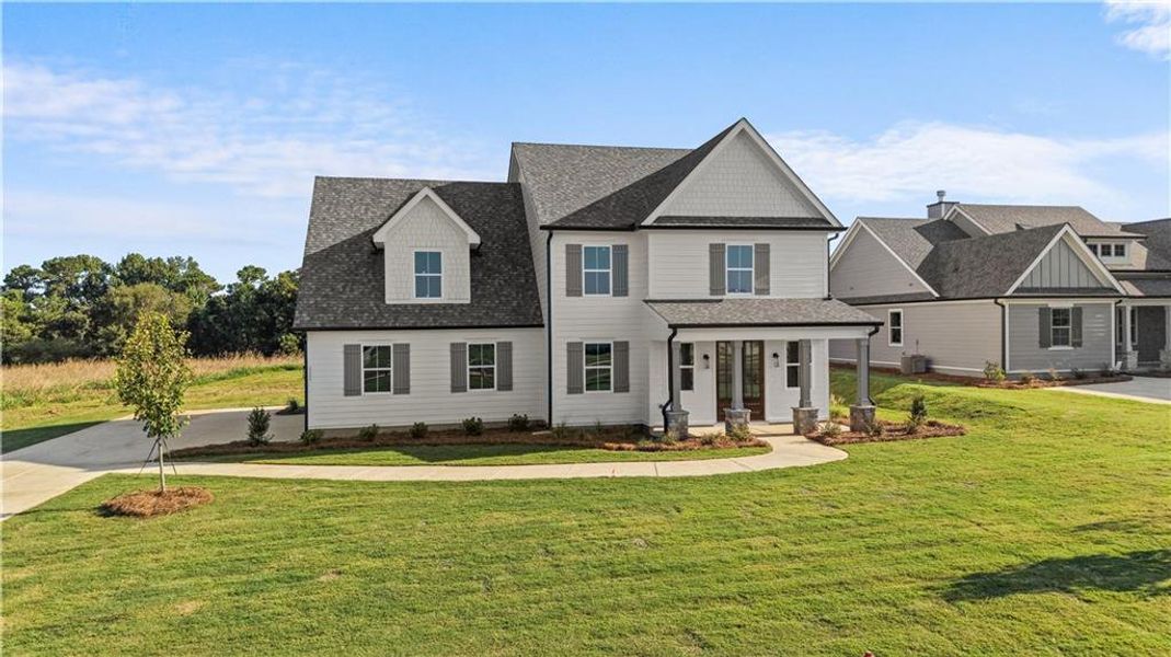 Front exterior of a new home in , Madison, GA, highlighting curb appeal (Image 30). Front exterior of a new home in , Madison, GA, highlighting curb appeal (Image 30).