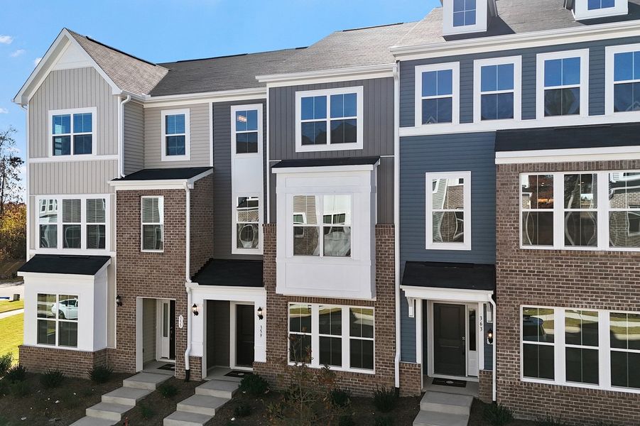 Front exterior of a new home in Renaissance at White Oak, Garner, NC, highlighting curb appeal (Image 2). Front exterior of a new home in Renaissance at White Oak, Garner, NC, highlighting curb appeal (Image 2).